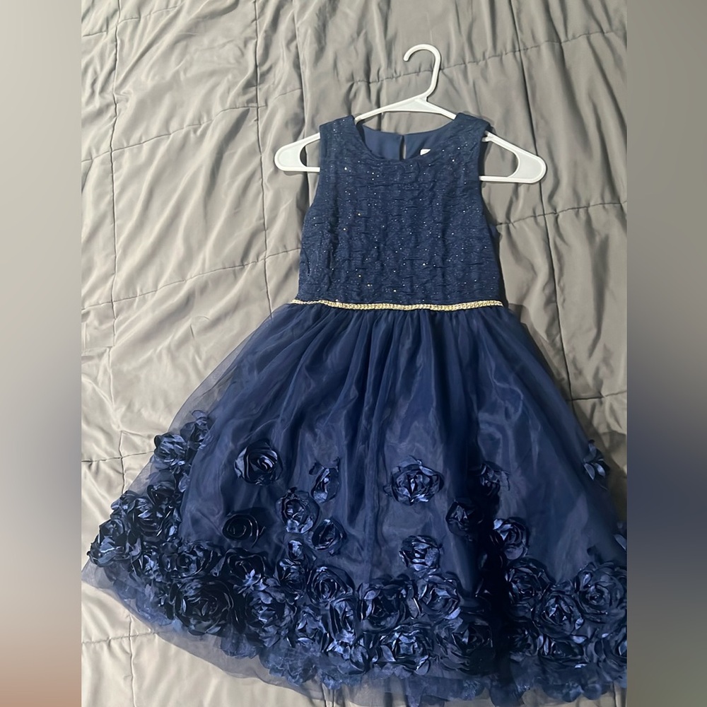 Selling girls size 12 used once . Dressy navy blue dress .